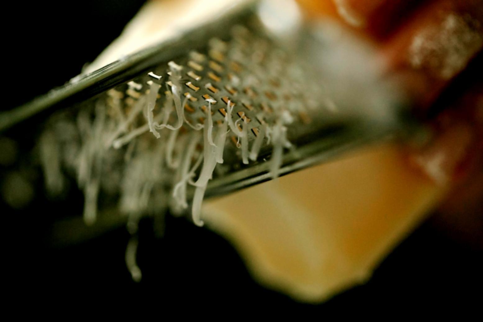 Hands-on culinary instruction demonstrating precise cooking techniques